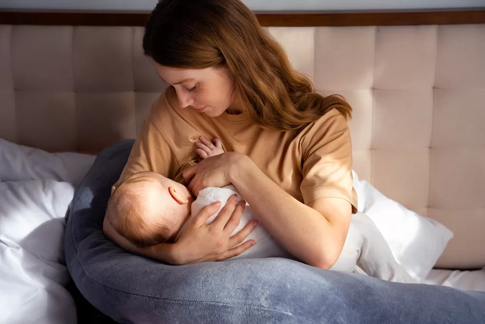 medium-shot-mother-with-cute-newborn.jpg